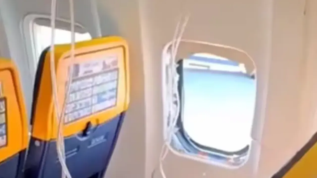 RaynAit uçuşunda cam kırıldı, dışarı çekilen yolcu son anda kurtarıldı