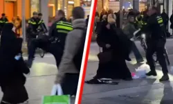 Hollanda'da gözaltına alınan tesettürlü kadına polis müdahalesi tepki çekti